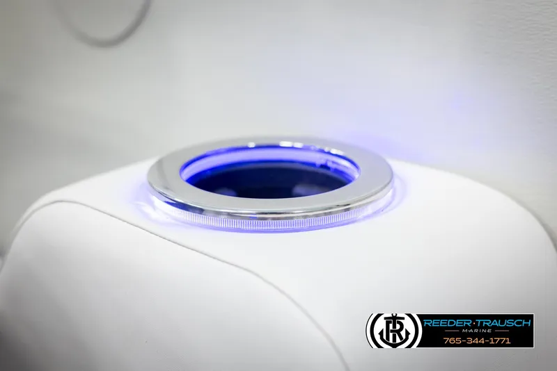 Slide: The Image of Illuminated cup holder on 2025 Avalon Catalina QL boat, featuring sleek design and blue lighting. - 37