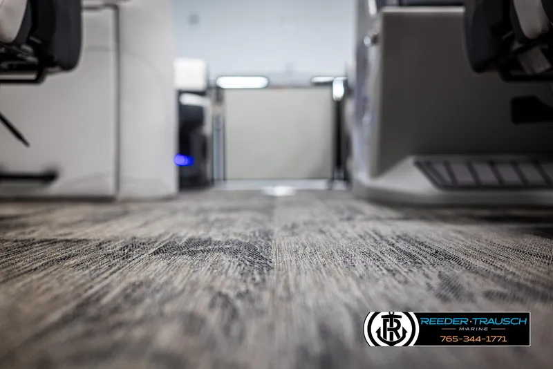 Slide: The Image of Interior view of 2025 Avalon Catalina QL boat, showcasing detailed flooring and seating arrangement. - 39