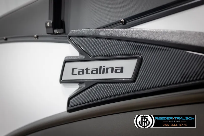 Slide: The Image of 2025 Avalon Catalina QL boat logo with carbon fiber texture, Reeder-Trausch Marine branding. - 44