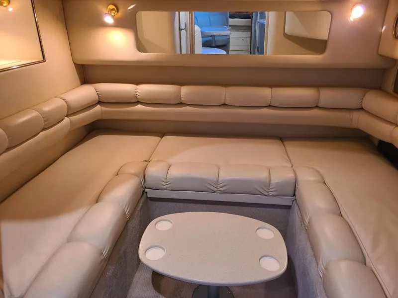 Slide: The Image of Luxurious interior of 1998 Sea Ray 400 Sundancer yacht with beige leather seating. - 14