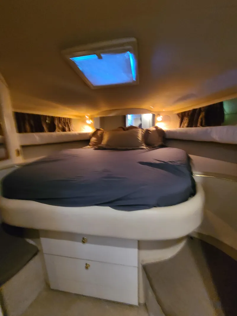 Slide: The Image of Cozy cabin interior of 1998 Sea Ray 400 Sundancer yacht with skylight. - 19