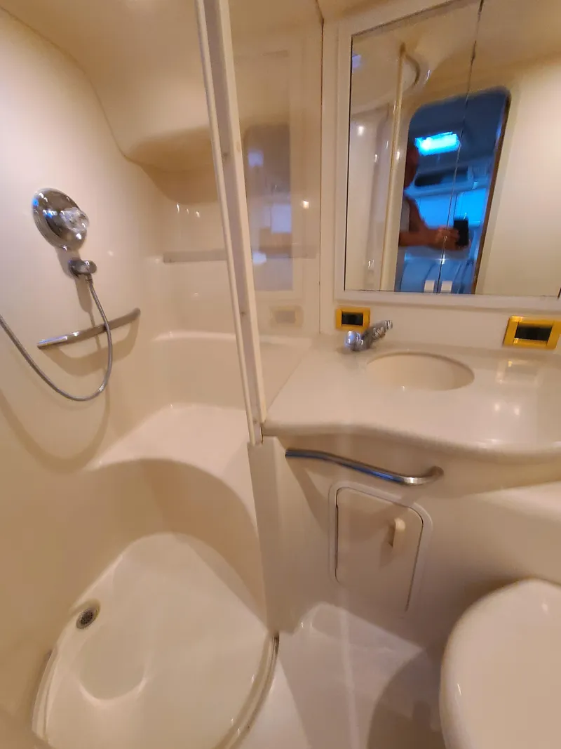 Slide: The Image of Bathroom interior of 1998 Sea Ray 400 Sundancer yacht with shower and sink. - 22
