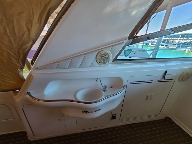 Slide: The Image of 1998 Sea Ray 400 Sundancer yacht interior with sink and window view. - 9