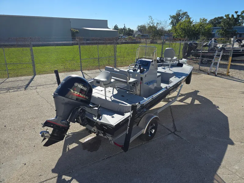 Slide: The Image of 2022 Xpress H20B boat with Yamaha outboard motor on trailer. - 4