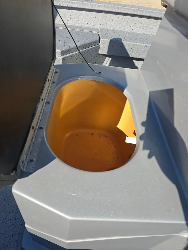 Slide: The Image of Open storage compartment in 2022 Xpress H20B boat. - 9