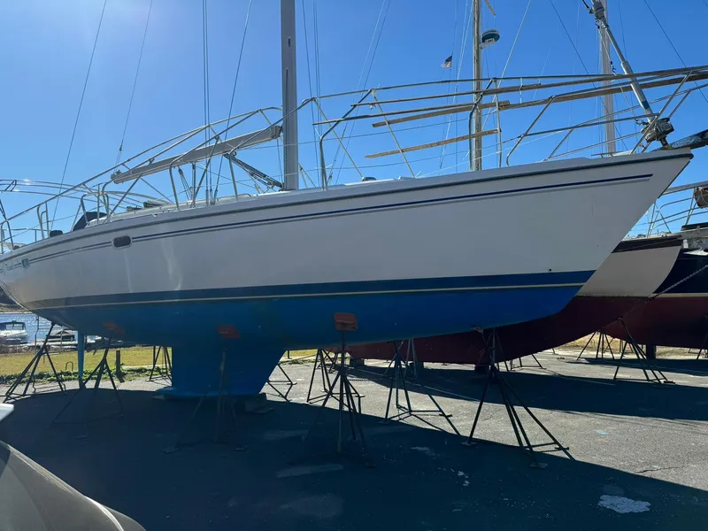 Slide: The Image of 2004 Catalina 42 MkII sailboat on stands, blue hull, sunny day. - 14