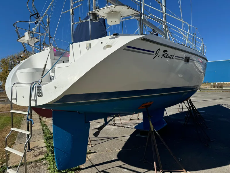 Slide: The Image of 2004 Catalina 42 MkII sailboat on dry dock, blue hull, sunny day. - 18