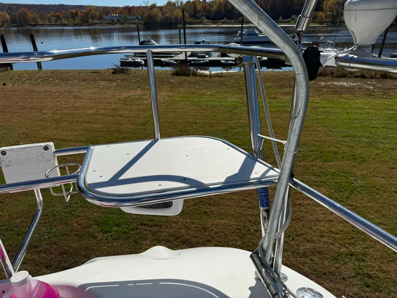 Slide: The Image of Catalina 42 MkII 2004 sailboat deck with stainless steel railing by a serene waterfront. - 26