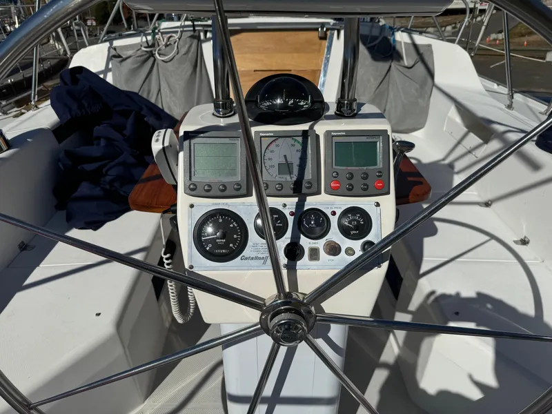 Slide: The Image of Cockpit of 2004 Catalina 42 MkII sailboat with navigation instruments and steering wheel. - 27