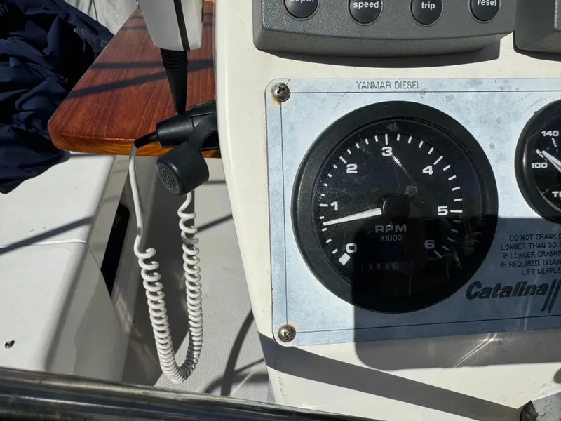 Slide: The Image of Close-up of 2004 Catalina 42 MkII yacht dashboard with Yanmar diesel RPM gauge. - 29