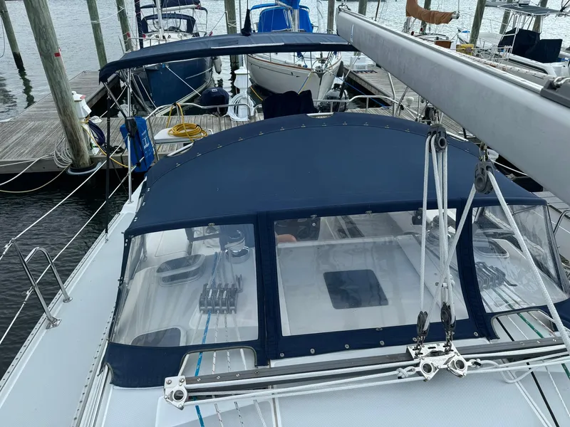 Slide: The Image of Catalina 42 MkII sailboat, 2004 model, docked with blue canopy and visible rigging. - 3