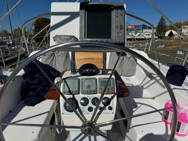 Slide: The Image of Cockpit of 2004 Catalina 42 MkII sailboat with navigation instruments and steering wheel. - 31