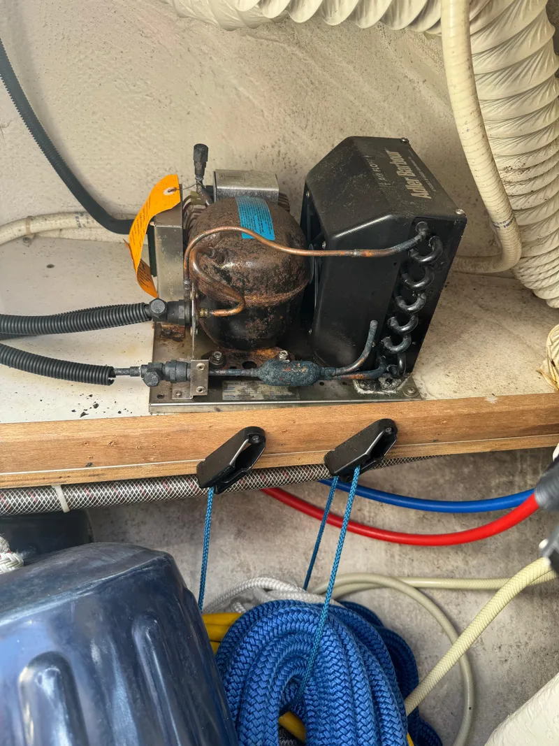 Slide: The Image of Catalina 42 MkII 2004 boat engine compartment with wiring and equipment. - 32