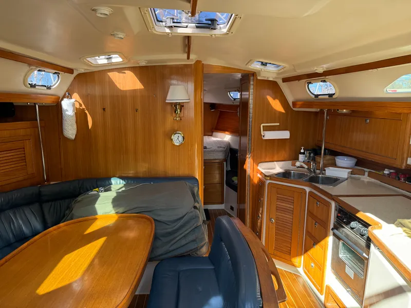 Slide: The Image of Interior of 2004 Catalina 42 MkII sailboat with wood finish and cozy seating area. - 33