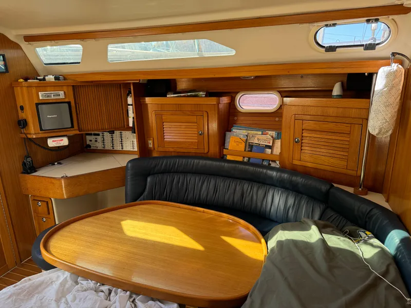 Slide: The Image of Interior of 2004 Catalina 42 MkII sailboat with wooden cabinetry and seating area. - 39