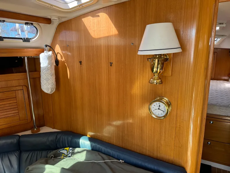 Slide: The Image of Interior of 2004 Catalina 42 MkII sailboat with wood paneling and brass fixtures. - 40