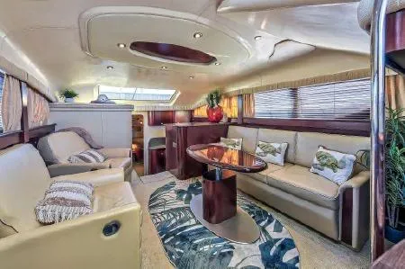 Slide: The Image of Luxurious 2008 Sea Ray 40 Motor Yacht interior with elegant seating and decor. - 49