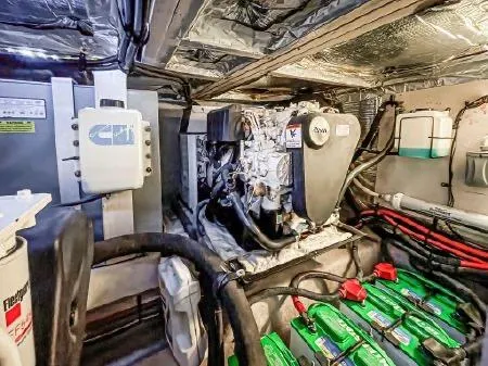 Slide: The Image of Engine room of 2008 Sea Ray 40 Motor Yacht with visible machinery and batteries. - 96