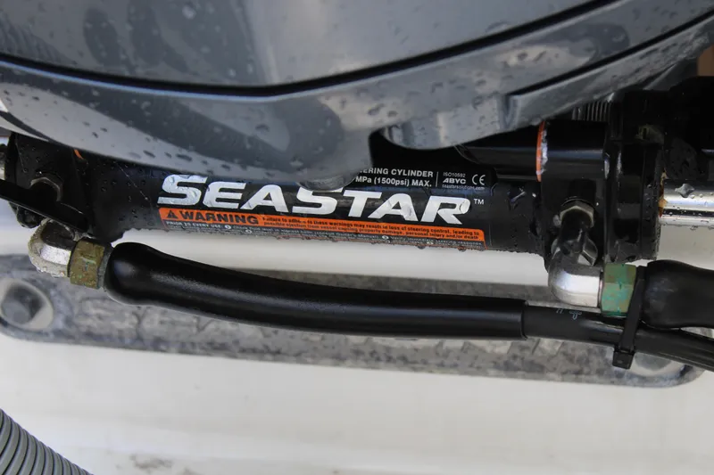 Slide: The Image of Close-up of SeaStar hydraulic steering on 2018 Sea Hunt Ultra 255 SE boat. - 13