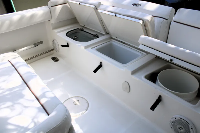 Slide: The Image of 2018 Sea Hunt Ultra 255 SE boat interior with open storage compartments. - 15