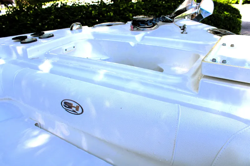 Slide: The Image of 2018 Sea Hunt Ultra 255 SE boat interior with logo and seating area. - 42