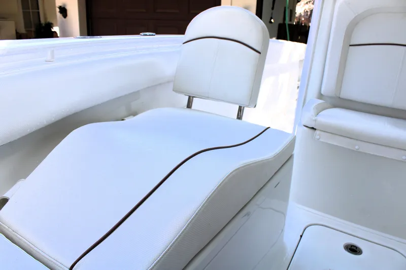 Slide: The Image of 2018 Sea Hunt Ultra 255 SE boat interior seating, white upholstery, modern design. - 43