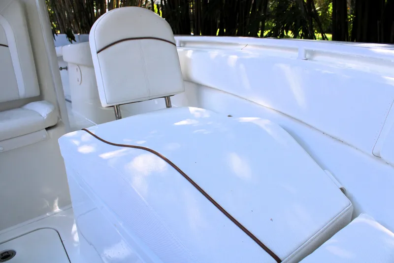 Slide: The Image of 2018 Sea Hunt Ultra 255 SE boat interior with white seating and sleek design. - 44