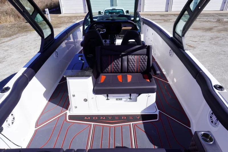 Slide: The Image of 2025 Monterey Elite 30 OB boat interior with stylish seating and modern design. - 10