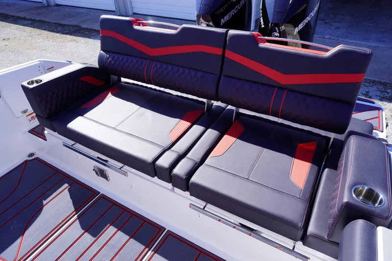 Slide: The Image of 2025 Monterey Elite 30 OB boat seating with stylish black and red upholstery. - 11