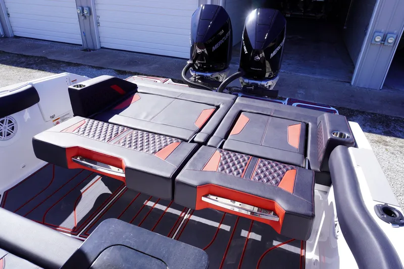 Slide: The Image of 2025 Monterey Elite 30 OB boat interior with stylish seating and dual outboard motors. - 13