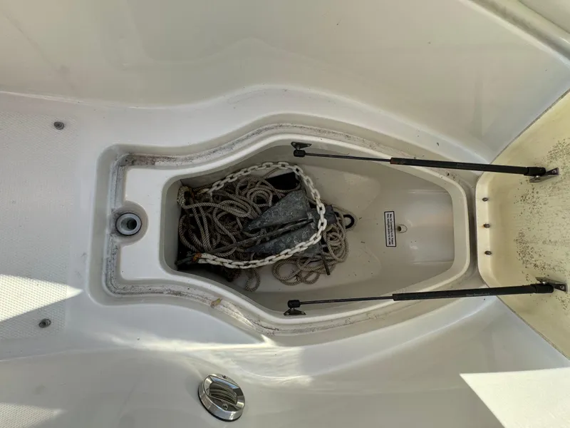 Slide: The Image of Anchor storage compartment on 2008 Sea Ray 230 Sundeck boat. - 10