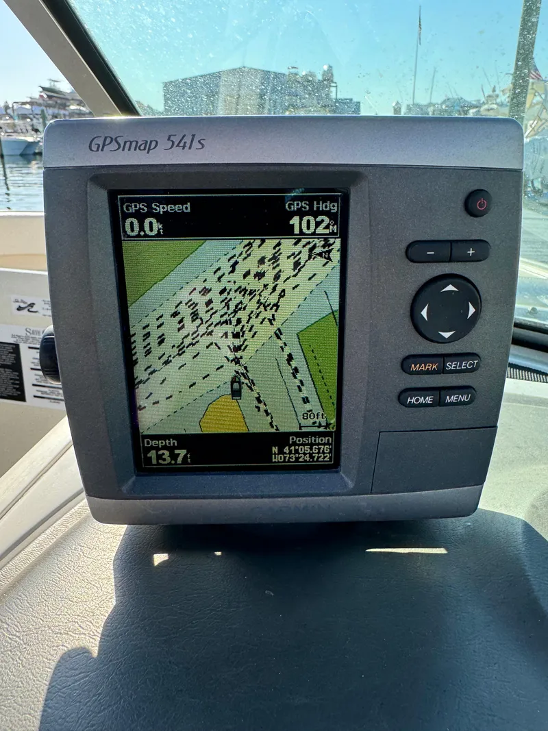 Slide: The Image of GPS navigation system on 2008 Sea Ray 230 Sundeck boat dashboard. - 18