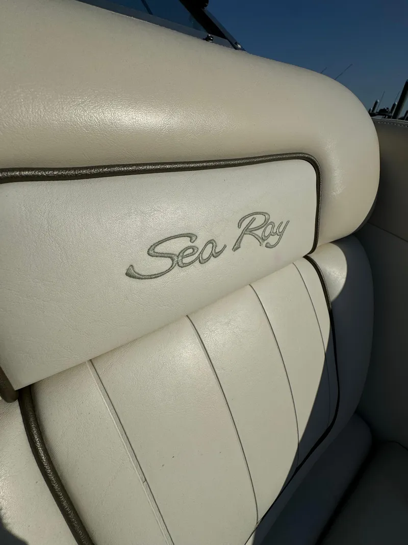 Slide: The Image of Close-up of 2008 Sea Ray 230 Sundeck white leather seat with logo. - 3