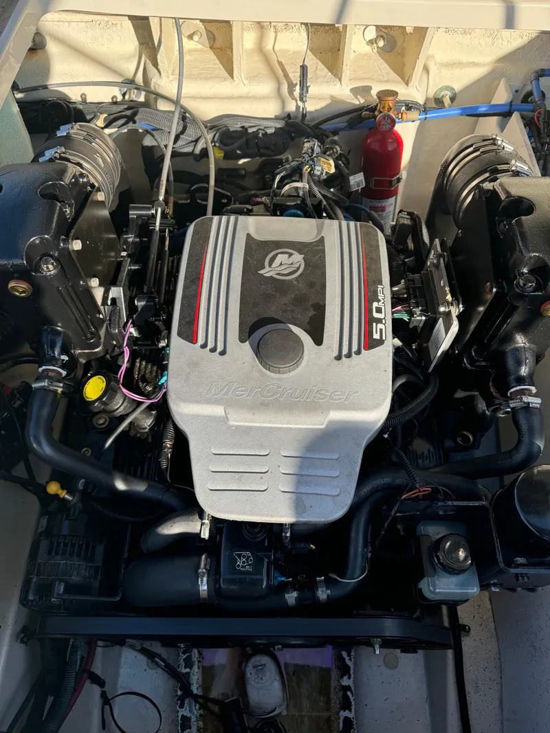 Slide: The Image of 2008 Sea Ray 230 Sundeck engine compartment with Mercury 5.0L motor. - 4