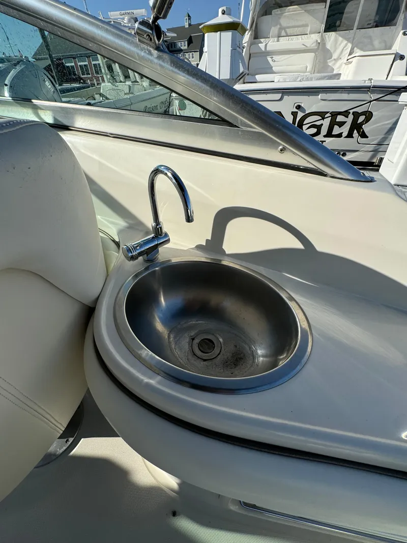 Slide: The Image of 2008 Sea Ray 230 Sundeck boat interior with stainless steel sink. - 6