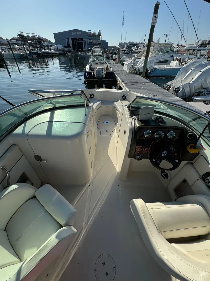Slide: The Image of 2008 Sea Ray 230 Sundeck boat interior at marina dock. - 9