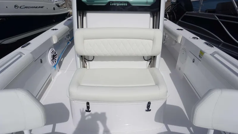 Slide: The Image of 2025 Everglades 253 CC boat interior with white seating and sleek design. - 6