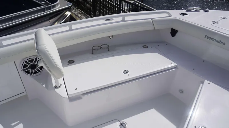 Slide: The Image of 2025 Everglades 253 CC boat interior with seating and storage compartments. - 7