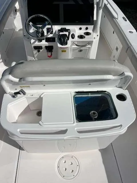 Slide: The Image of 2022 Everglades 273 CC boat interior with helm and seating area. - 5