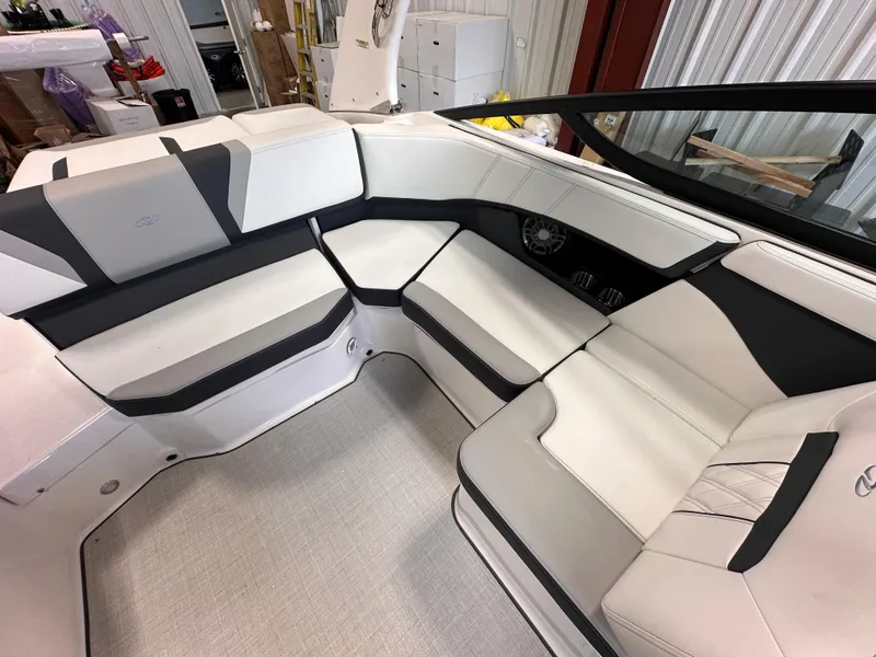 Slide: The Image of 2025 Regal 2000 ES boat interior with sleek white and black seating. - 10