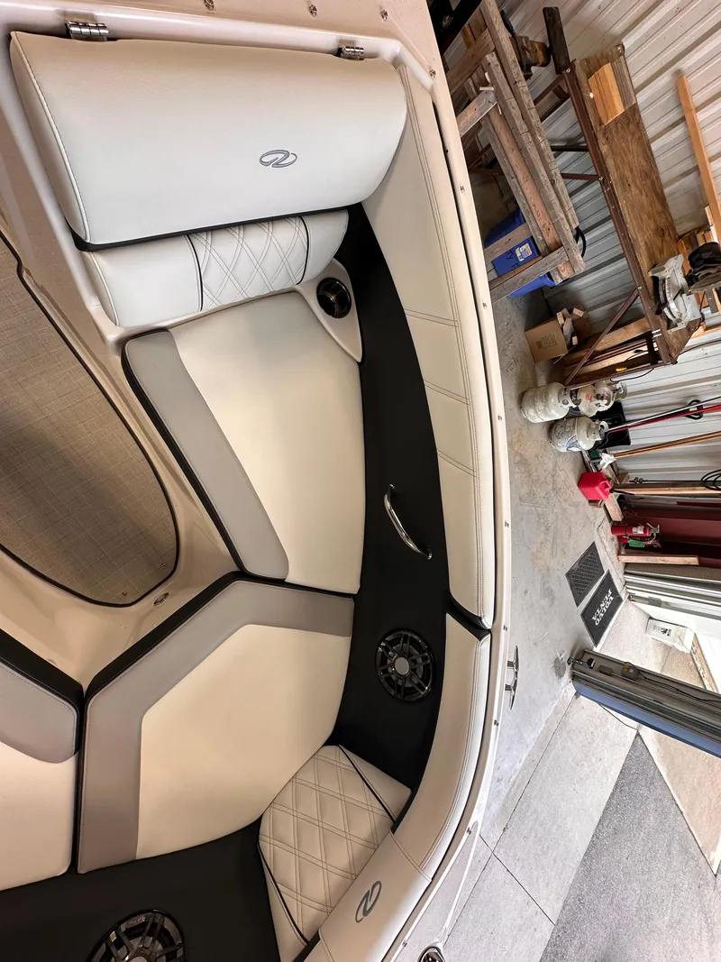 Slide: The Image of Luxurious interior of 2025 Regal 2000 ES boat with plush seating and modern design. - 15