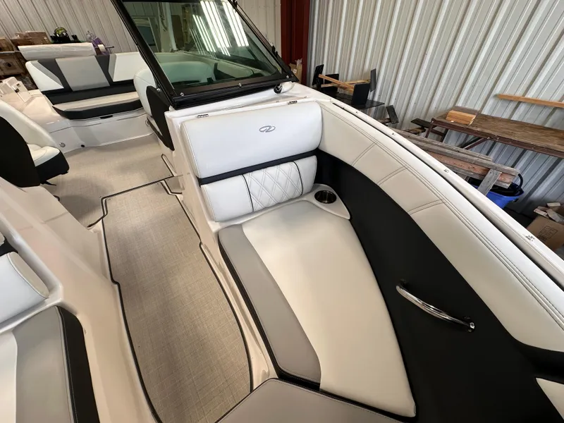 Slide: The Image of 2025 Regal 2000 ES boat interior with sleek white and black seating. - 18