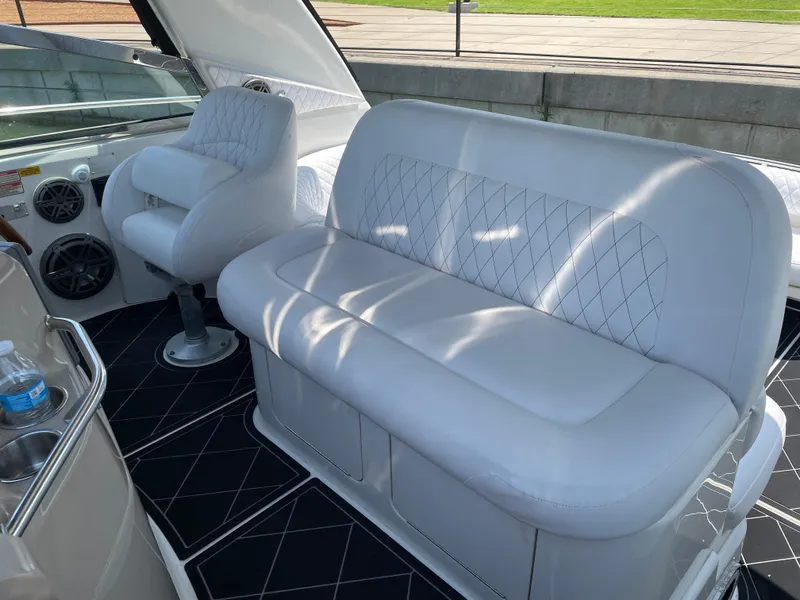 Slide: The Image of 1998 Sea Ray 400 Sundancer interior with white seating and modern design. - 4