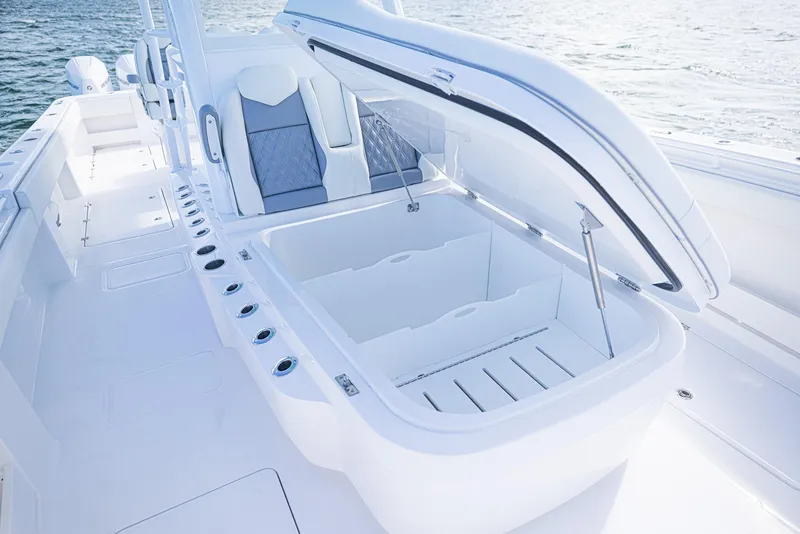Slide: The Image of 2025 Invincible 35 Catamaran with open storage compartment on deck. - 14