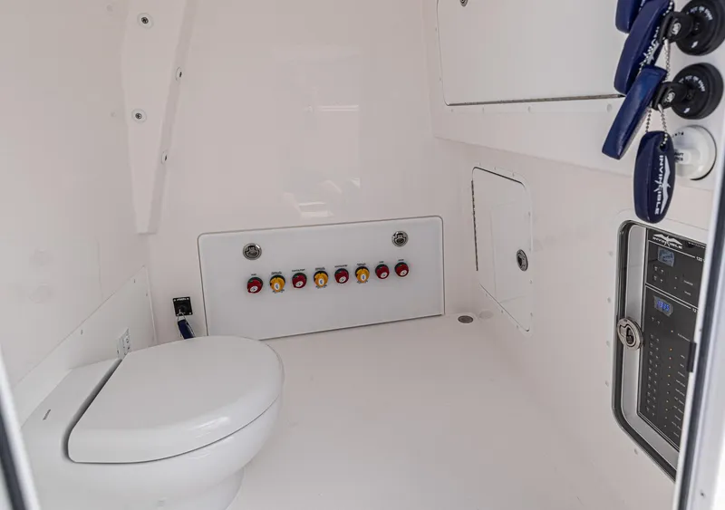 Slide: The Image of 2025 Invincible 35 Catamaran interior with toilet and control panel. - 25