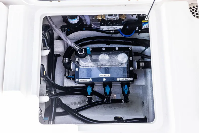 Slide: The Image of 2025 Invincible 35 Catamaran engine compartment with visible wiring and components. - 27