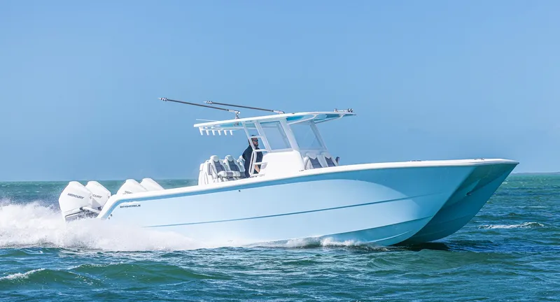Slide: The Image of 2025 Invincible 35 Catamaran cruising on open water. - 39