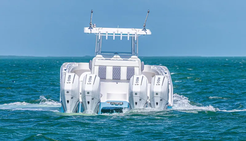 Slide: The Image of 2025 Invincible 35 Catamaran with quad engines cruising on open water. - 4