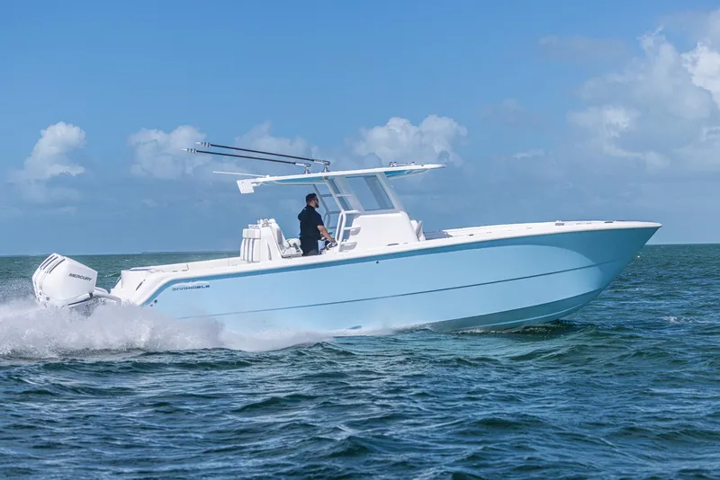 Slide: The Image of 2025 Invincible 35 Catamaran cruising on open water under clear skies. - 40