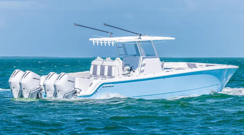 Slide: The Image of 2025 Invincible 35 Catamaran cruising on open water with triple outboard engines. - 5